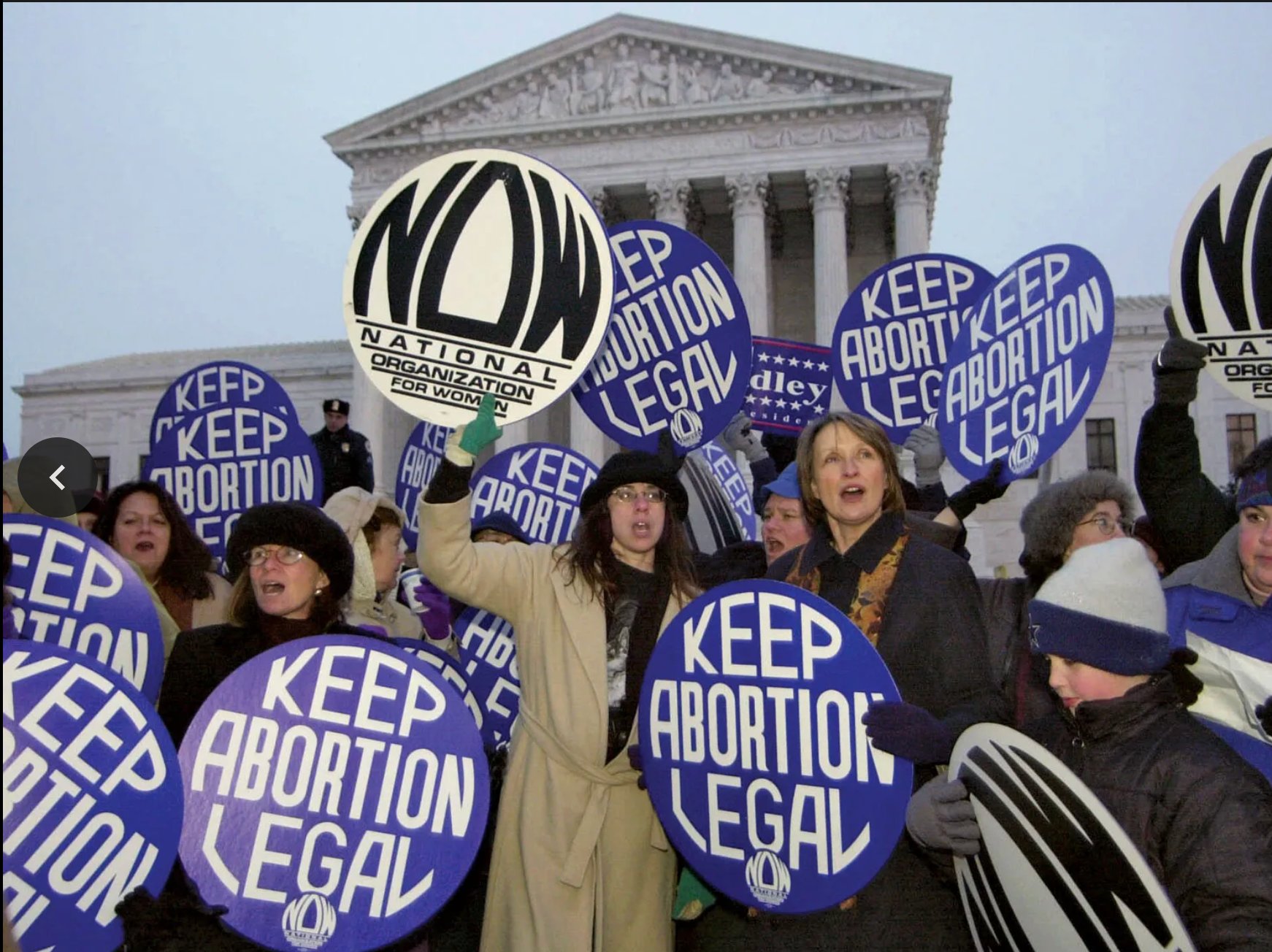 NOW members rally at the U.S. Supreme Court with Keep Abortion Legal signs